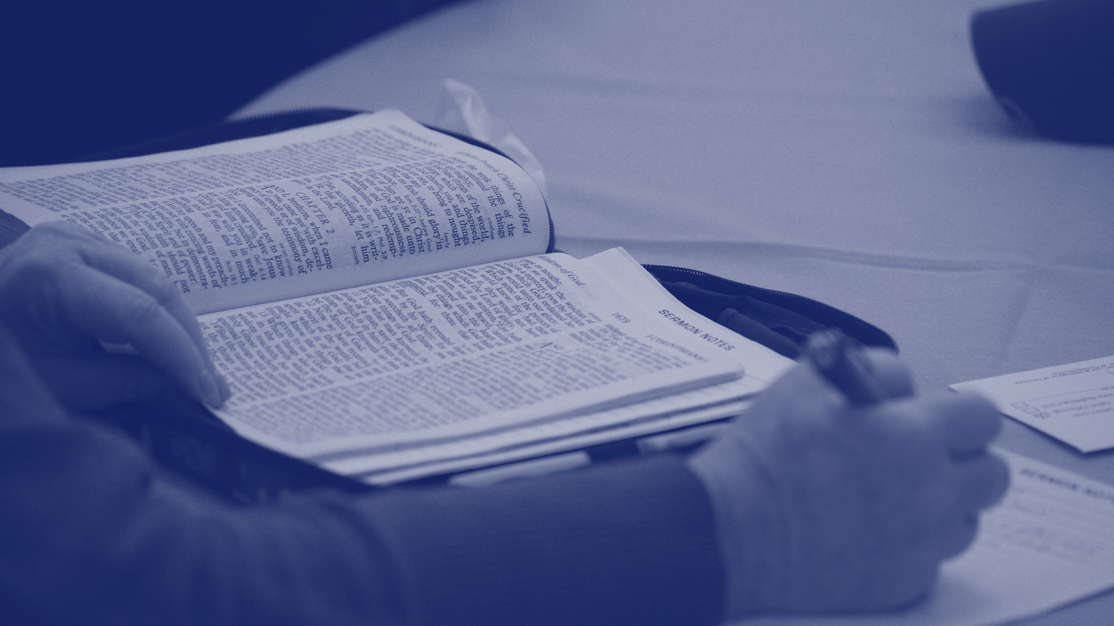 A member of Church On The Way takes notes during Bible study